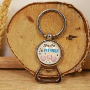 Porte-clé décapsuleur avec inscription humoristique “J’peux pas, j’ai pétanque”